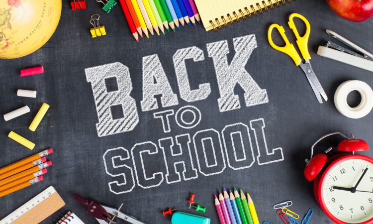 School supplies on blackboard background