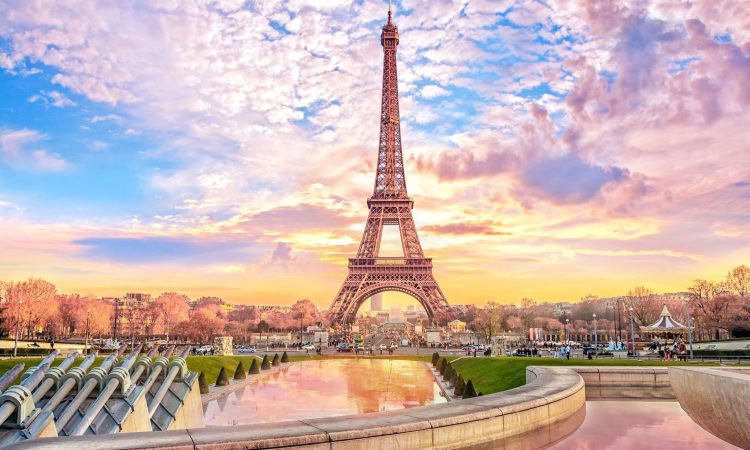 Eiffel Tower at sunset in Paris, France. Romantic travel background