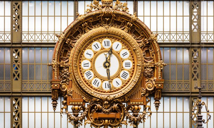 Golden clock of the museum D'Orsay.The Musee d'Orsay is a museum in Paris, on the left bank of the Seine. Musee d'Orsay has the largest collection of impressionist and post-impressionist paintings in the world.